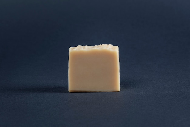 Yellow bar soap on a dark surface