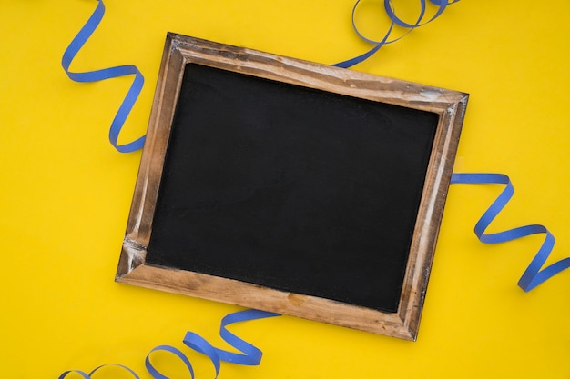 Yellow birthday decoration with slate