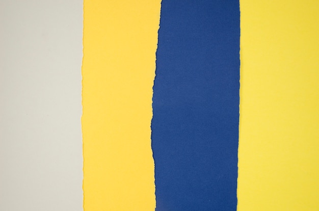 Yellow and blue abstract composition with colour papers