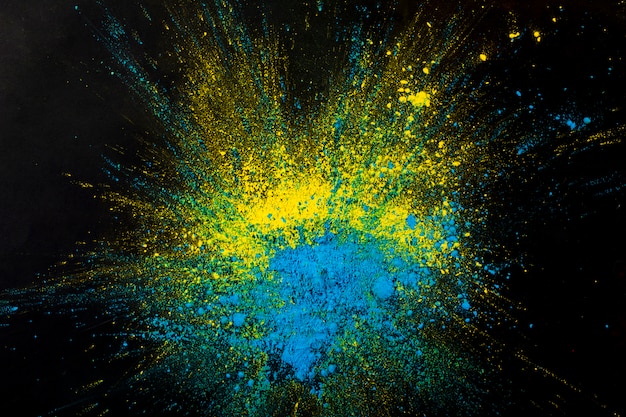 Fondo astratto giallo e blu della polvere di colore asciutto