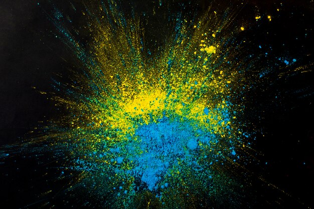 黄色と青のドライカラーパウダーの抽象的な背景