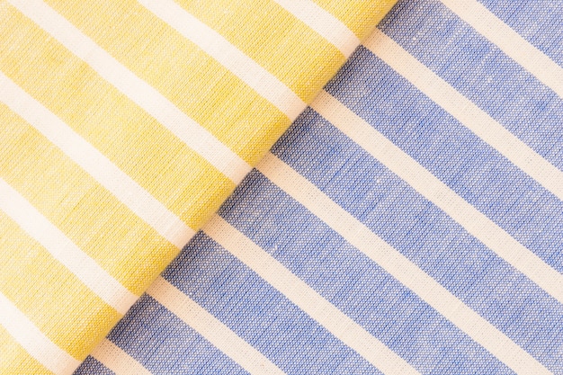 Текстура ткани желтого и синего льняных тканей