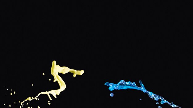 Yellow and blue liquid splashing on opposite side