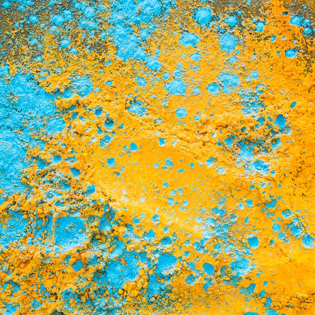 Yellow blue powder on table