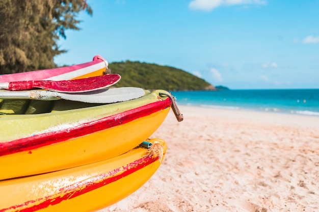 Yellow boats on sea shore