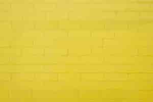 無料写真 黄色のレンガの壁の背景の質感