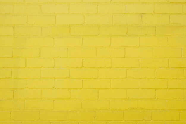 노란 벽돌 벽 배경 질감