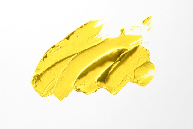 Yellow brush stroke on white background