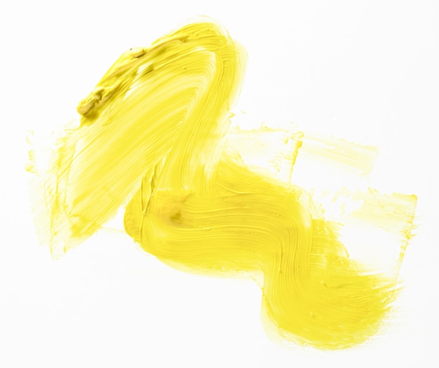 Yellow brush stroke on white background