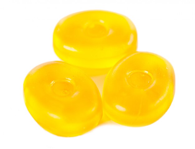 Yellow candies isolated on a white  