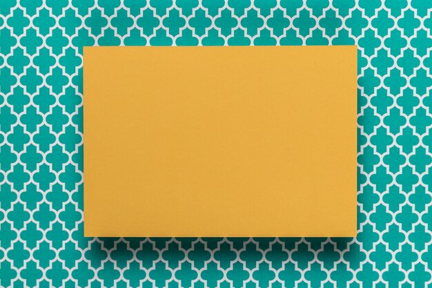 Yellow card on teal background