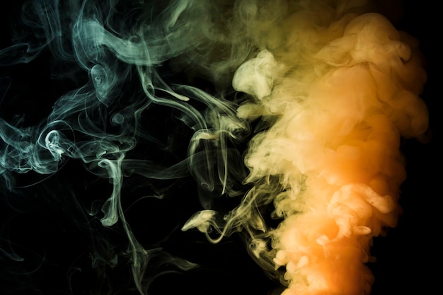 Yellow dense fume of smoke abstract black background