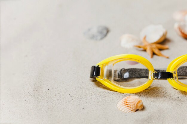 Yellow diving glasses with shells