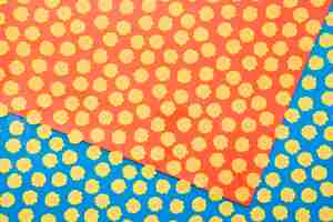 Free photo yellow dots on blue and red background