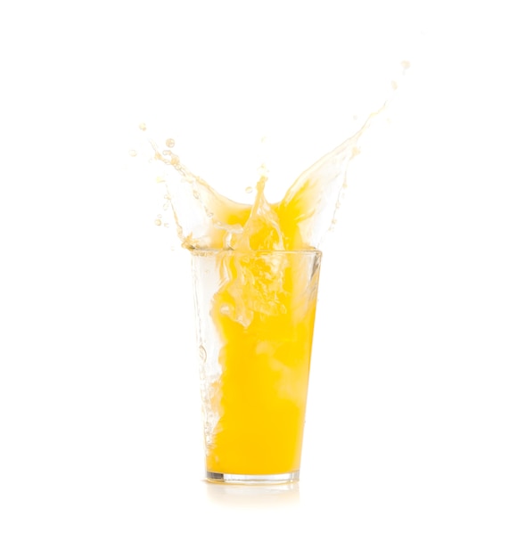 Yellow drink falling in ice