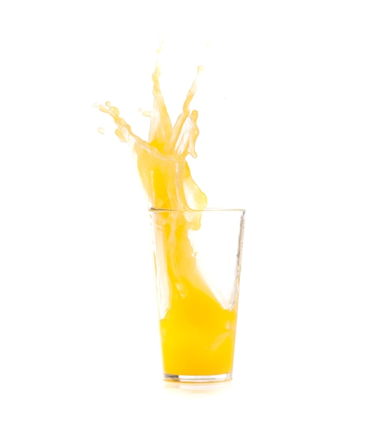 Yellow drink falling in ice