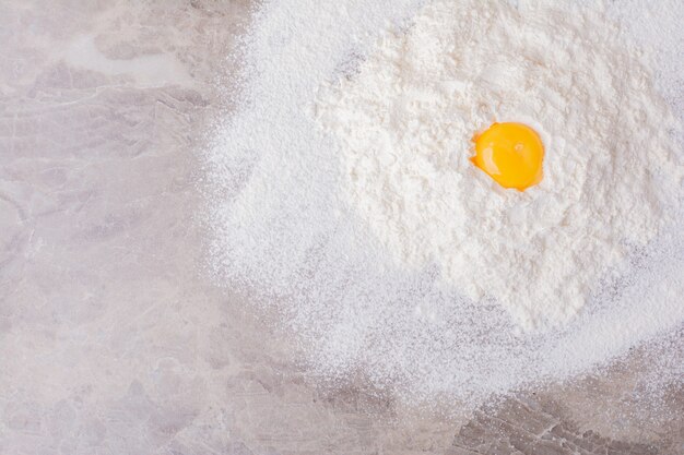 Yellow egg yolk on blended flour.