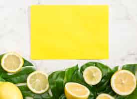 Free photo yellow empty card with lemons