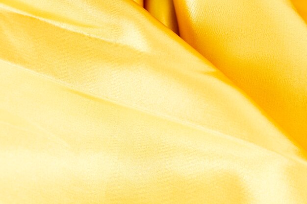 Желтая текстура тканевого материала с копией пространства
