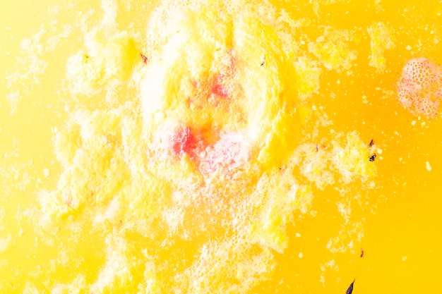 Free photo yellow fizzy bath bomb backdrop