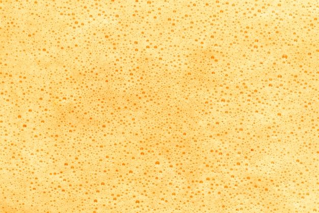 Yellow foam covering liquid