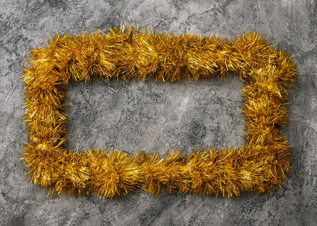 yellow frame from tinsel on table