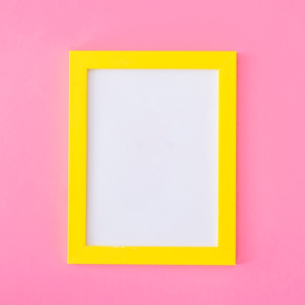 Free photo yellow frame on pink