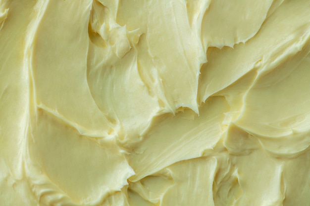 Yellow frosting texture background close-up