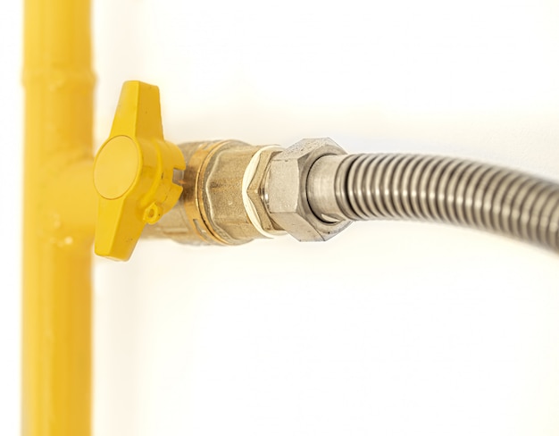 Free photo yellow gas pipe with a valve.