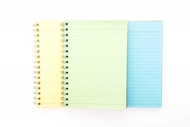 Yellow, green and blue notebooks