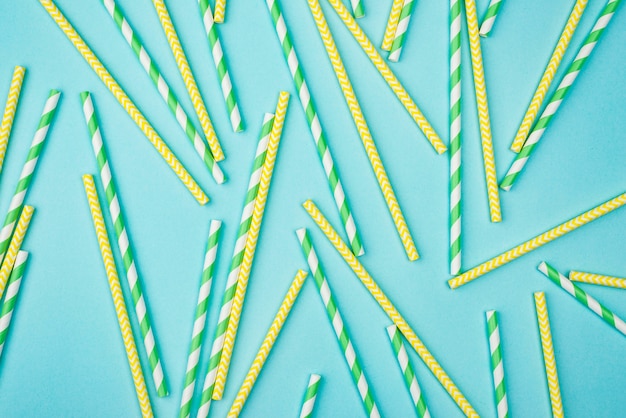 Yellow and green with white stripes straws