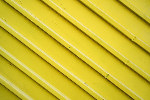 Yellow iron tin fence lined background. Metal texture