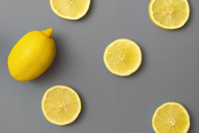 Yellow lemons on gray background