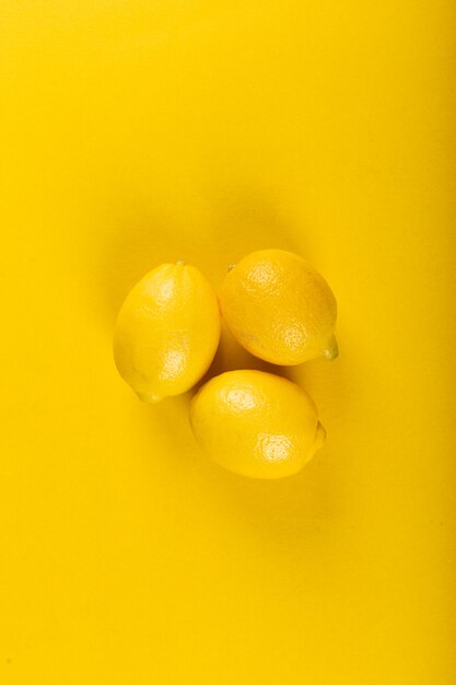 Yellow lemons isolated . top view
