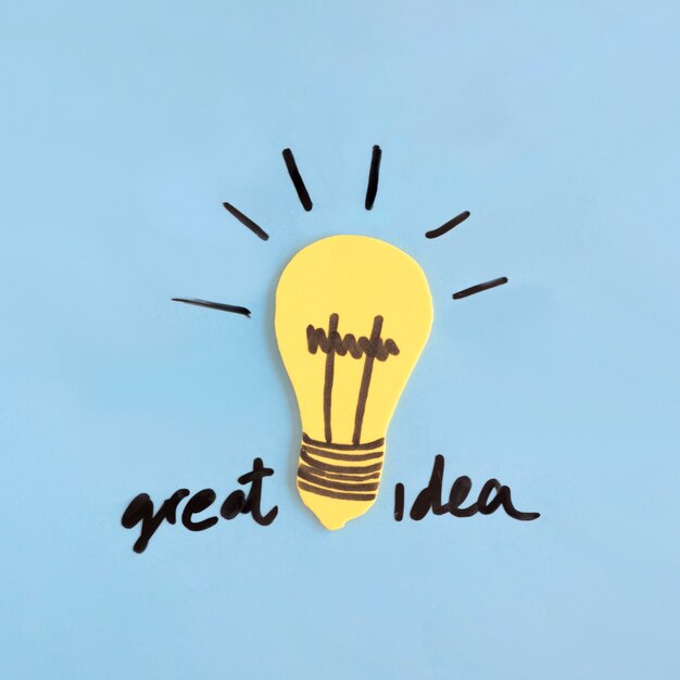 Yellow light bulb with great idea text on blue background