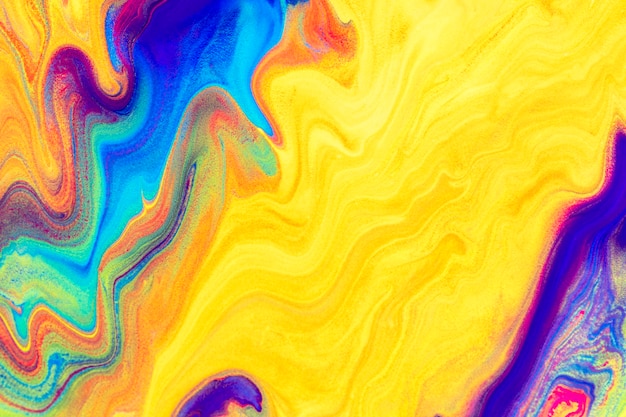 Yellow liquid marble background handmade colorful flowing texture experimental art