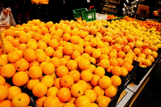 Yellow oranges on boxes at supermarket