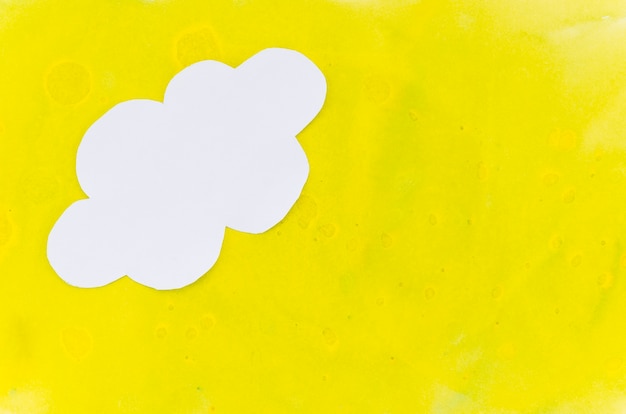 Yellow paint background with paper cloud