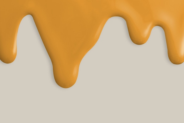 Yellow paint drip background in gray background