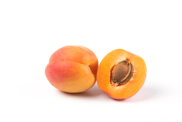 Yellow peaches isolated on white