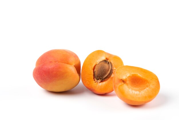 Yellow peaches isolated on white