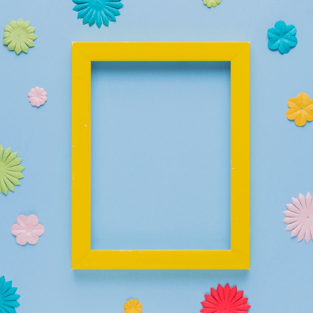 Yellow picture frame surrounded with beautiful flower cutout