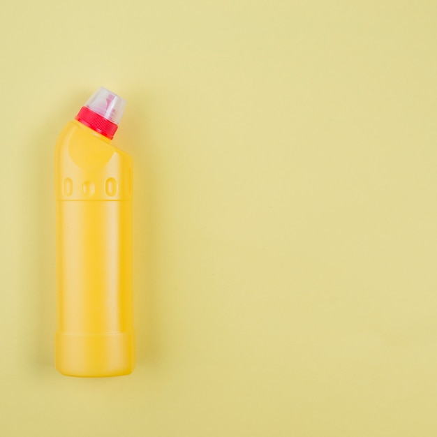 Free photo yellow plastic detergent bottle