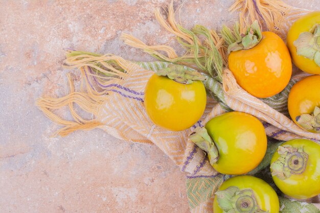 Yellow plum dates isolated on pink.