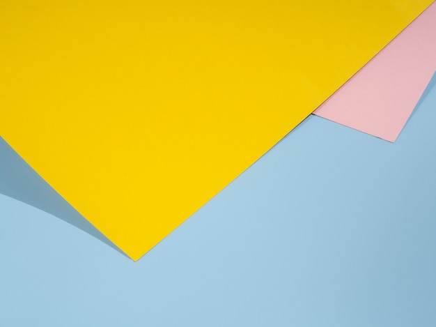 Free photo yellow polygon paper design