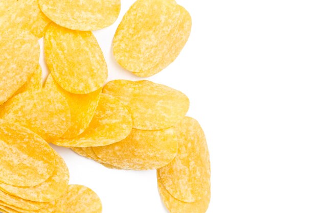 Yellow potato chips isolated on white