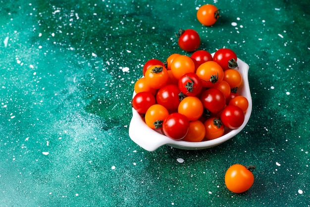 Yellow and red cherry tomatoes.