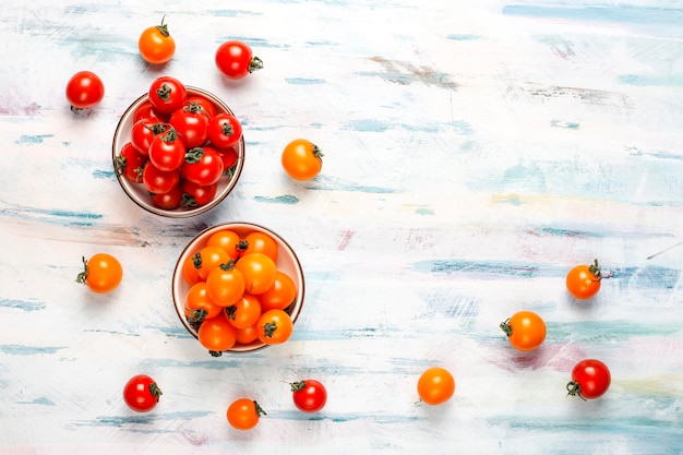 Free photo yellow and red cherry tomatoes.