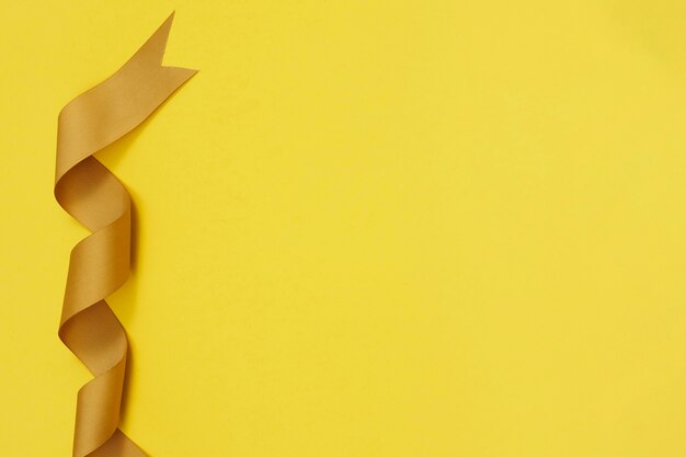 Yellow ribbon on yellowish background