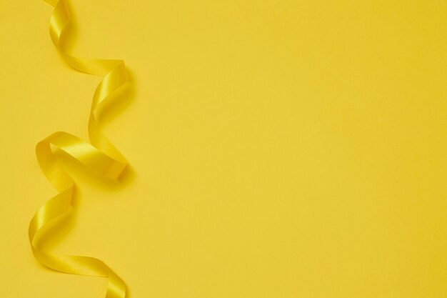 Yellow ribbon on yellowish background